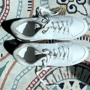 River Island lace up sneakers with gold and pink snake skin accent.